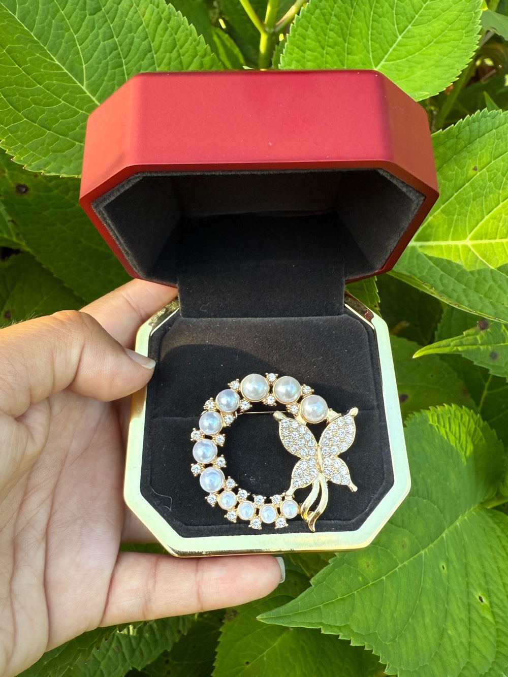 Elegant wreath brooch with butterfly